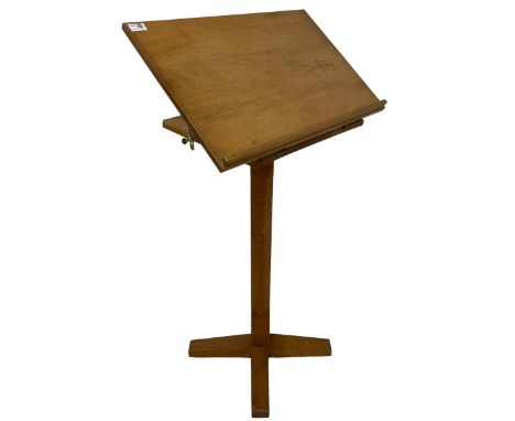 Mid-to-late 20th century light oak lectern, adjustable hinged top with book rest, square chamfered column on cruciform sledge