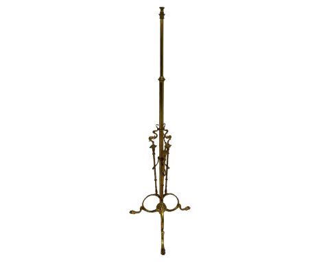 Mid-20th century gilt metal standard lamp, telescopic stem with scroll cast pillar supports on splayed tripod base, paw cast 