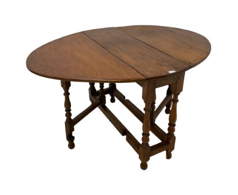 17th century design oak drop-leaf dining table, gate-leg action base, on turned supports joined by stretchersDimensions: Heig