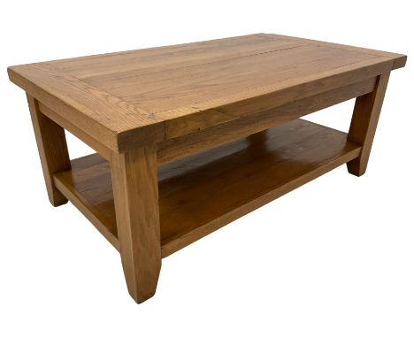 Light oak rectangular coffee table, square supports joined by under-tier Dimensions: Height:&nbsp;50cm&nbsp; Length/Width:&nb