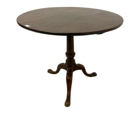 George III mahogany tripod table, circular tilt-top on turned baluster pedestal, three splayed supports with pad feetDimensio