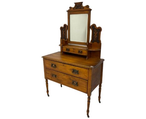 Late Victorian satin walnut dressing table, raised swing mirror with bevelled plate over two small trinket drawers, carved wi