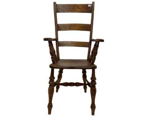 Elm and beech farmhouse armchair, high ladder back over swept arms with ring turned spindle supports, shaped saddle seat rais