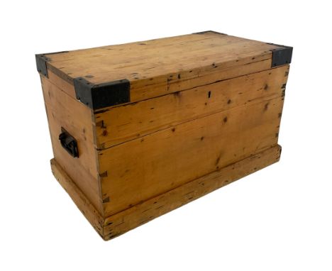 Early 20th century pine tool chest, the rectangular hinged top with ebonised interior, enclosing removable tool shelf, with w