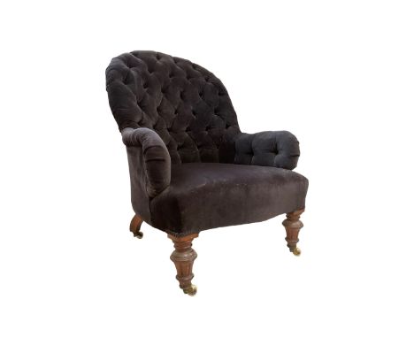 Victorian walnut framed open armchair, upholstered in buttoned midnight blue navy velvet with sprung seat, raised on turned a