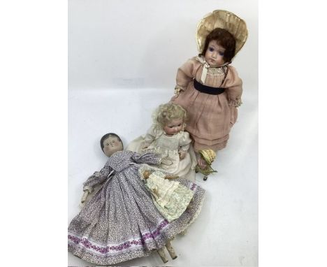 Antique dolls group to include a Marseille 985 bisque head &nbsp;8&rdquo; baby doll and another German bisque head in a rose 