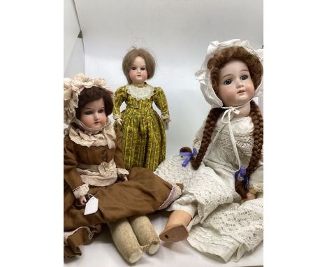 Antique German bisque head dolls to include a A8M Armand Marseille doll and a 390 bisque Head Armand Marseille doll and a Mar