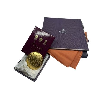 A vintage Asprey compact, gold tone with tiny enamelled flowers and a boxed and unworn vintage Asprey scarf made from a fine 