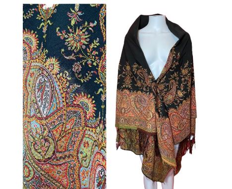 A late 19th century Kashmir shawl made from a fine wool. Central black ground with a scrolling boteh border in rich autumnal 