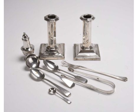 A pair of silver mounted candlesticks, (one unmarked), together with a silver pickle fork, a silver sugar ladle, two silver s