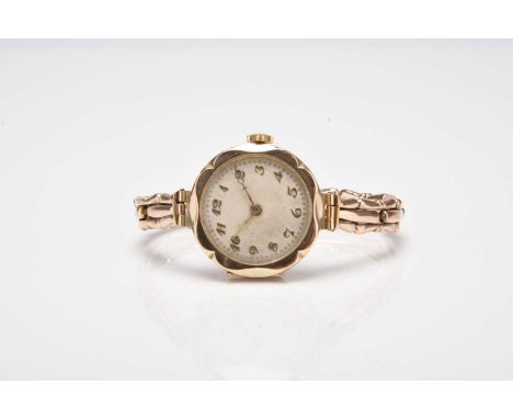 A lady's 9ct gold bracelet watch Date: Circa 1925 Movement: 15-jewel manual wind Dial: Silver, applied Arabic hour markers, g