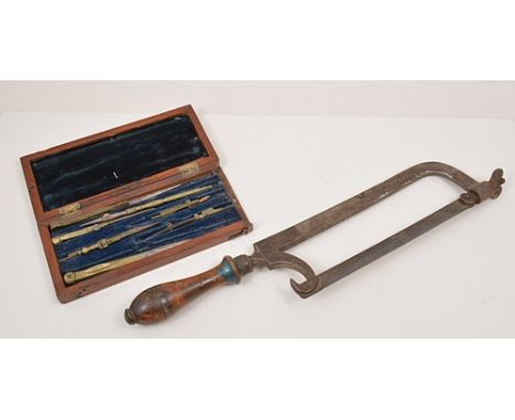 Part geometry set in a mahogany case, width 20cm, Fillister plane, a small tenon saw and other saws.