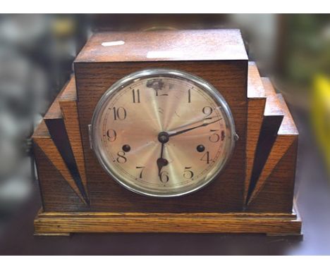Oak mantel clock, stepped case, silvered dial, movement striking on four gongs, 32cm, three Venetian painted trays, an Easter