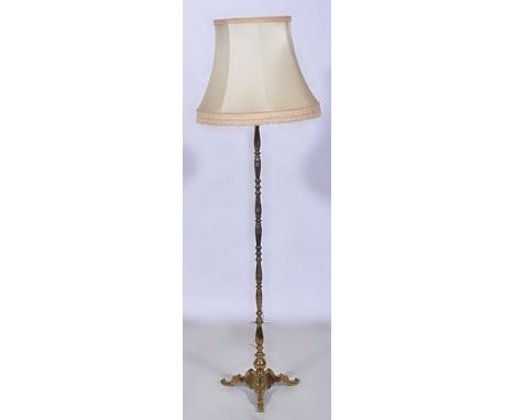 Brass standard lamp, ringed column, tripod base, complete with shade, 168cm.