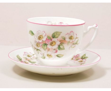 Coalport bone china six place dinner service, decorated with apple blossom, including tea cups and saucers.