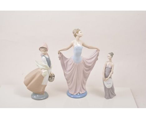 Lladro figure of a ballerina, 32cm, two other Lladro figurines and two Nao figurines (5).