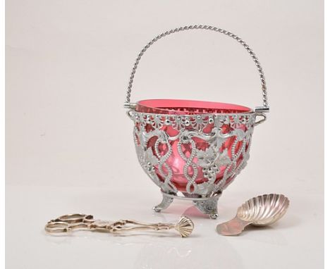 Irish silver caddy spoon, Dublin, modern, scallop bowl, a pair of white metal scissor shape sugar nips, a plated sugar basket