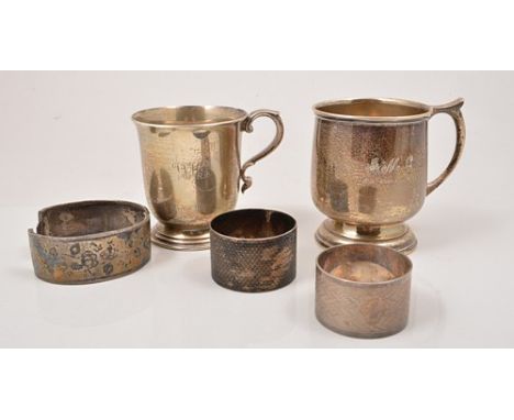 Large silver Capstan ink well, Birmingham 1932, diameter 13cm, two silver mugs, napkin rings, cigarette box and hinged bangle