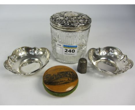 Cut glass dressing table jar with embossed silver cover, pair of trinket dishes, thimble and Mauchlin pin cushion