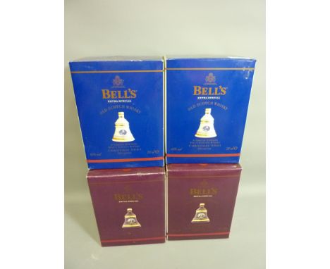Four limited edition Bells Christmas Scotch Whisky decanters 2001 x 2, 2002 x 2