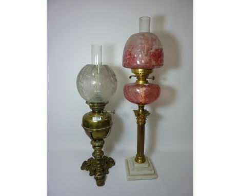 Early 20th century brass Corinthian column oil lamp and one other oil lamp