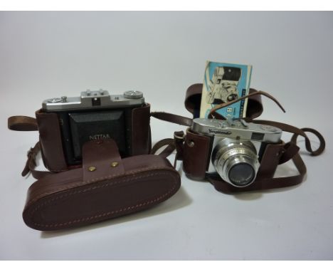 Vintage cameras - 1950s Voigtlander Vito B 35mm film camera and a 1950s Zeiss Ikon 120 film camera - with user manuals