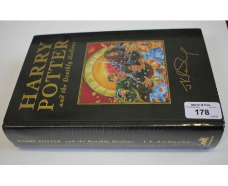 A sealed first edition copy of Harry Potter and the Deadly Hallows, published by Bloomsbury, gilt cloth hardback cover with f