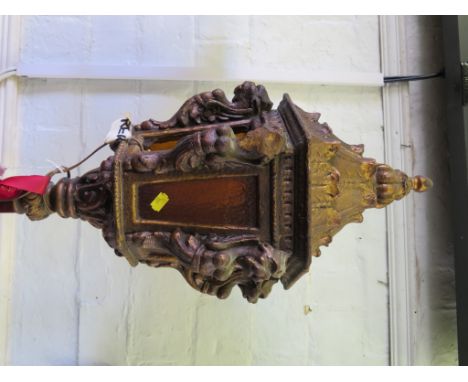 A Venetian style carved giltwood standard light, the lantern top on a red velvet stem and scrolling triform base, 202cm high