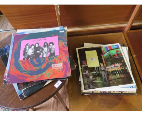A collection of vinyl records, including Lou Reed, Tom Jones, Leonard Cohen, Michael Jackson, Morrissey, The Cure and Public 