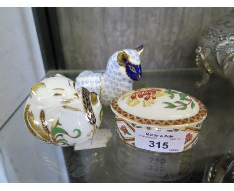 A Royal Crown Derby paperweight of a lamb 6.5cm high, another of a sleeping dormouse 7cm, both with gold stoppers and a honey