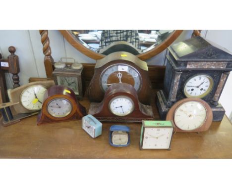 A Victorian slate and pink marble mantel clock, 33cm high and nine other table clocks