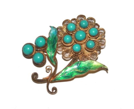 A gilded flower brooch decorated with enamel and turquoise