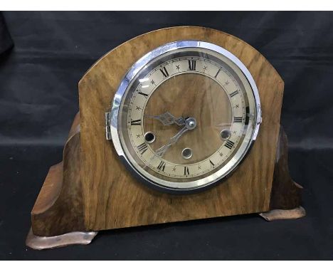 DOME TOPPED MANTEL CLOCK with three front winding key holes, key within the back
