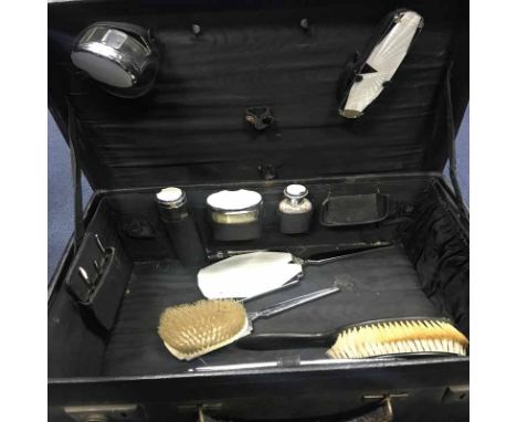 BLACK LEATHER TRAVELLING DRESSING CASE with part Art Deco fittings