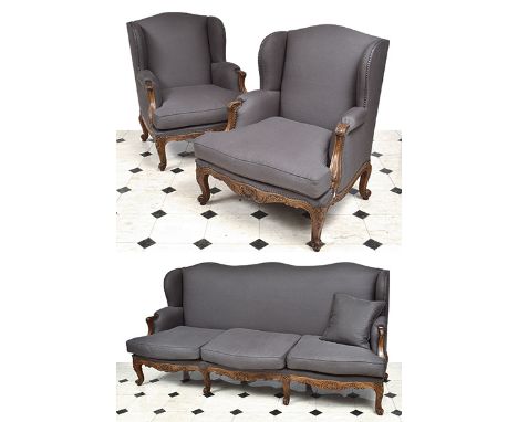 A LOUIS XV STYLE THREE PIECE LOUNGE SUITE

comprising a three seat sofa and a pair of semi-wingback armchairs, each upholster