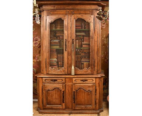 A FRENCH PROVINCIAL STYLE BUFFET A DEUX CORPS with a canted rectangular cornice and mesh panel doors, the lower section with 