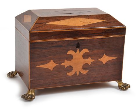 A VICTORIAN ROSEWOOD TEA CADDY
sarcophagus shaped, the lid inlaid with lozenges and fine marquetry borders, internally compar