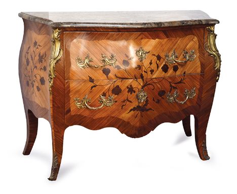 A LOUIS XV STYLE SERPENTINE TOP KINGWOOD COMMODE
rectangular top above a bombe base with two drawers inlaid with foliate marq