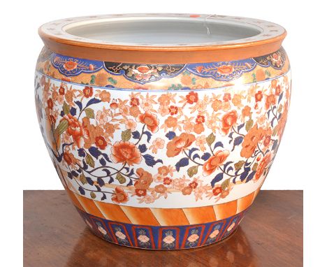 A SUBSTANTIAL CHINESE GLAZED CERAMIC FISHBOWL
the interior and exterior with floral decoration, the exterior further embellis