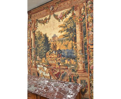 A PRINTED 18TH CENTURY STYLE TAPESTRY
depicting a hunting scene watched from a balcony, within a frame of fruits and flowers,