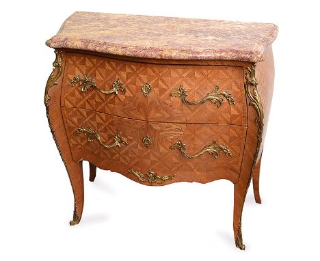 A LOUIS XV STYLE GILT METAL MOUNTED KINGWOOD COMMODE with a serpentine marble top above two parquetry inlaid drawers with gil
