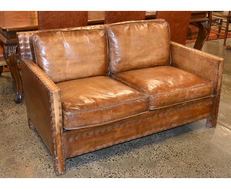 AN ART DECO STYLE STUDDED LEATHER TWO SEAT SOFA
145cm wide