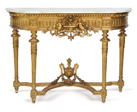 A 19TH CENTURY FRENCH GILTWOOD FRAMED CONSOLE

with a reverse breakfront marble top above a fluted apron with a central figur