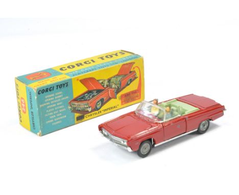 Corgi No. 246 Chrysler Imperial. Red with olive green interior. Good with more notable marks one side. In fair to good box. 