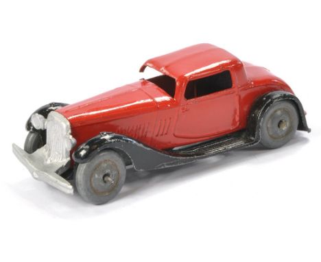 French Dinky Sports Coupe. Open chassis, metal wheels. Red. Some damage to one roof pillar but still displays well. As shown.