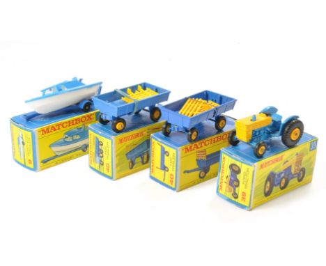 A group of four Matchbox Regular wheels comprising No. 9 Boat and Trailer, No. 40 x 2 Hay Trailer plus No. 39 Tractor. All ge