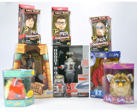 An assortment of electronic toys including Talkin Heads Osborne family, Furby duo, Lost in Space Robot plus Lara Croft Tomb R