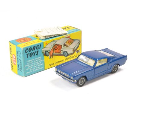 Corgi No. 320 Ford Mustang Fastback 2+2. Dark blue with off-white interior. Chrome trim. Generally very good. Notable mark on