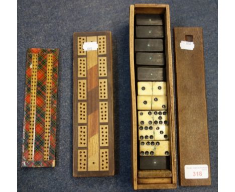  A COLLECTION OF 19TH CENTURY BONE AND EBONY DOMINOES, a Victorian Tartan Ware cribbage board and another cribbage board