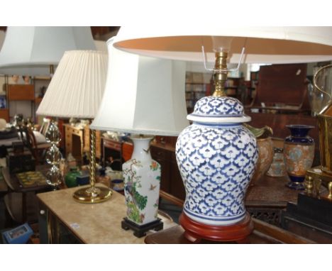 A TABLE LAMP in the form of a blue and white Chinese jar and cover and three other lamps